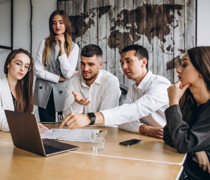 Group of people working out business plan in an office